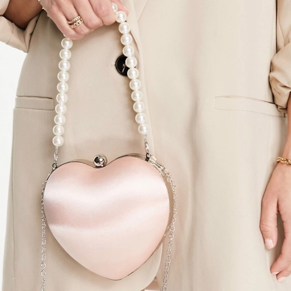 TRUE DECADENCE
Exclusive Heart Clutch Bag In Pink Satin With Faux Pearl Handle